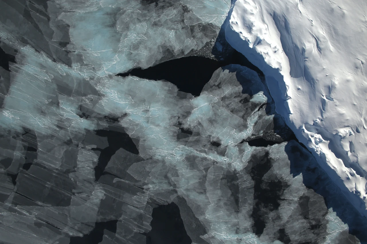 Newly formed sea ice next to an iceberg in Antarctica's Bellingshausen Sea, seen from NASA's Operation IceBridge