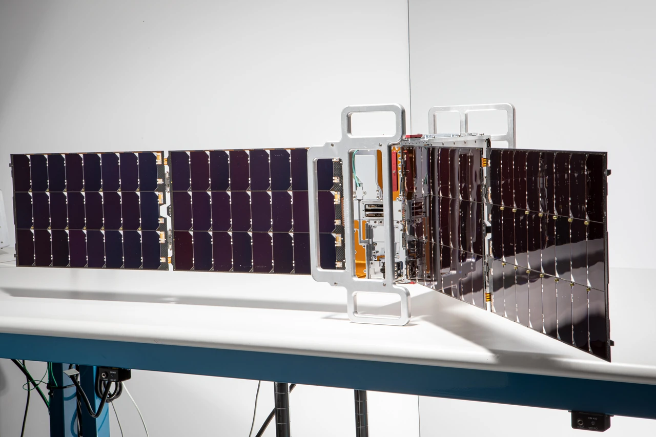 One of NASA's two shoebox-size PREFIRE CubeSats with its solar panels unfolded